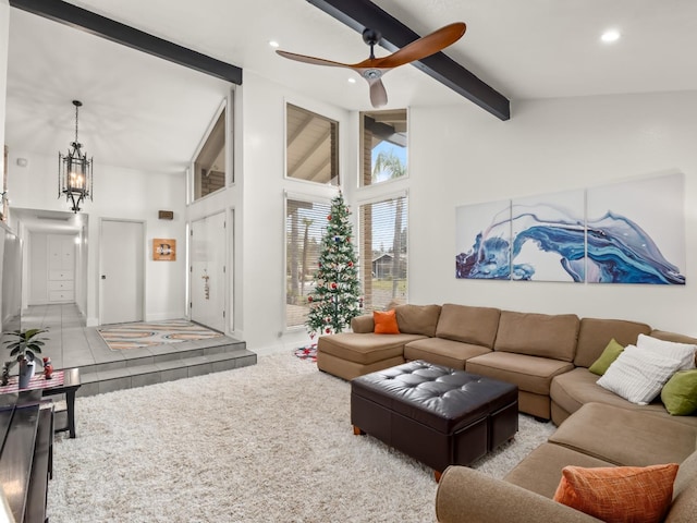 tiled living room with beam ceiling, ceiling fan, and high vaulted ceiling