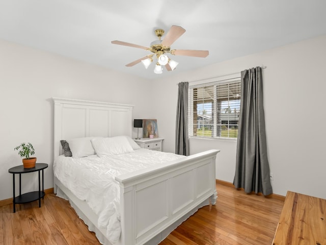 bedroom with light wood-type flooring and ceiling fan