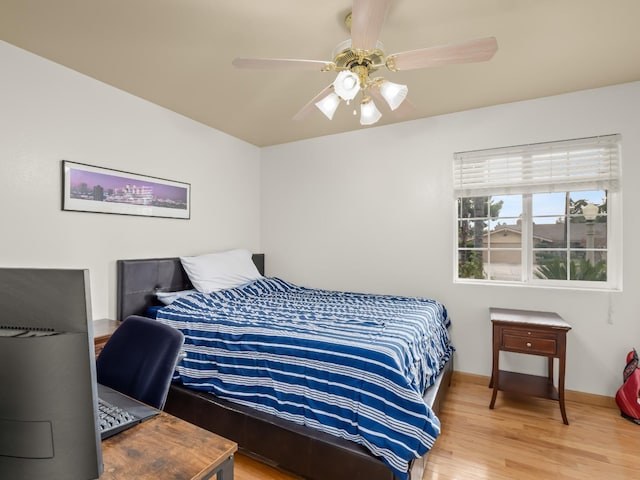 bedroom featuring hardwood / wood-style floors and ceiling fan