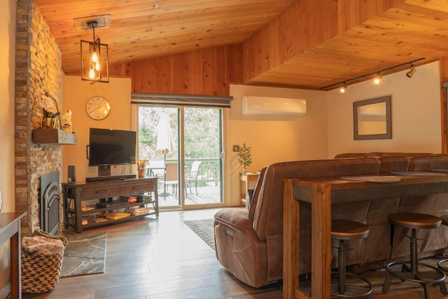 42135 Hanging Branch Rd, Shaver Lake, CA 93664 - living area with track lighting, a wall mounted air conditioner, vaulted ceiling, wood ceiling, and wood-type flooring