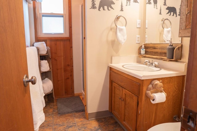 bathroom with vanity and a shower with door