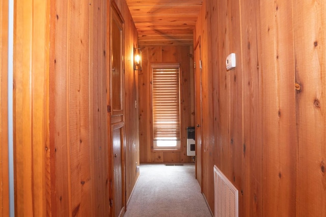 42135 Hanging Branch Rd, Shaver Lake, CA 93664 - hall featuring wooden walls, wood ceiling, carpet floors, and heating unit
