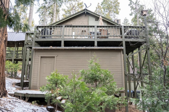 exterior space featuring a deck and central AC unit