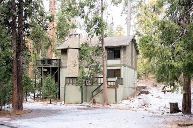 42135 Hanging Branch Rd, Shaver Lake, CA 93664 - view of front facade with stairs and roof with shingles