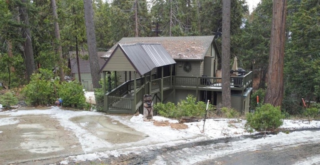 42135 Hanging Branch Rd, Shaver Lake, CA 93664 - view of front of property with a wooded view and a wooden deck