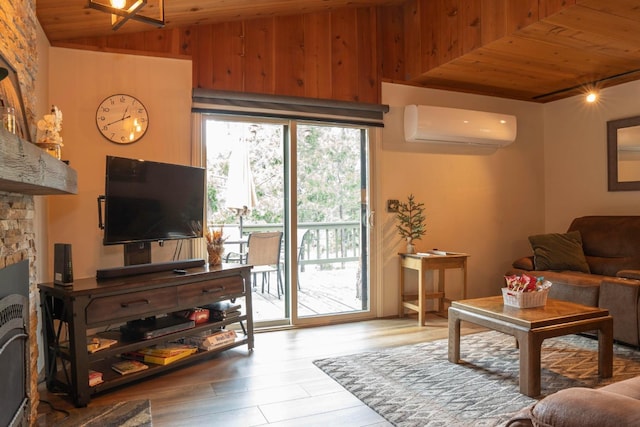 living room with wood ceiling, light wood-type flooring, a fireplace, and a wall unit AC