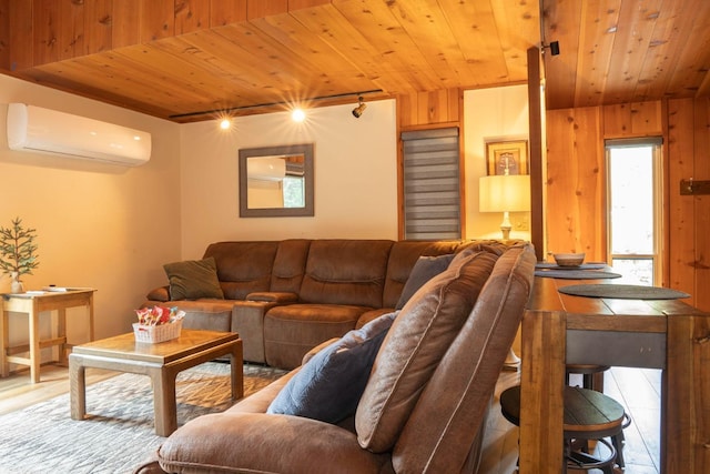 tiled living room featuring a wall mounted air conditioner, track lighting, wood walls, and wood ceiling