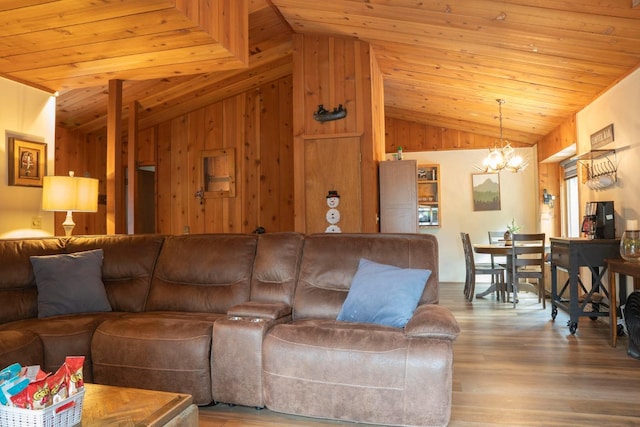 42135 Hanging Branch Rd, Shaver Lake, CA 93664 - living room with lofted ceiling, a chandelier, wood ceiling, wood finished floors, and wood walls