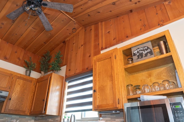 42135 Hanging Branch Rd, Shaver Lake, CA 93664 - detailed view of stainless steel microwave, a ceiling fan, brown cabinetry, and open shelves