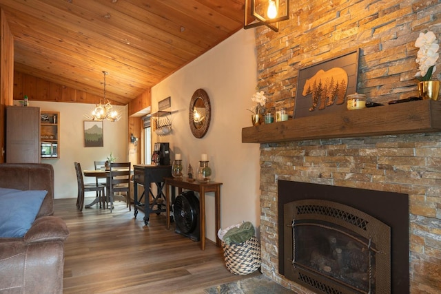42135 Hanging Branch Rd, Shaver Lake, CA 93664 - living area featuring vaulted ceiling, wood finished floors, a chandelier, wooden ceiling, and a glass covered fireplace