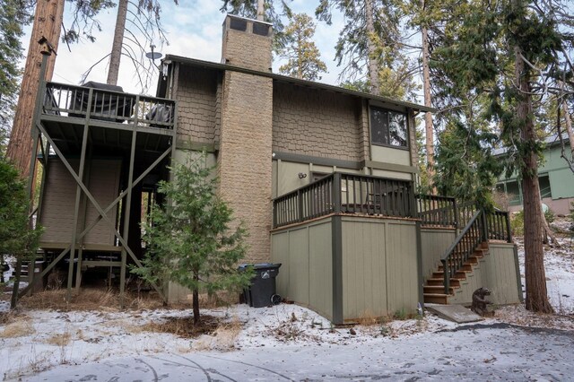 42135 Hanging Branch Rd, Shaver Lake, CA 93664 - snow covered property featuring stairs, a chimney, and a deck