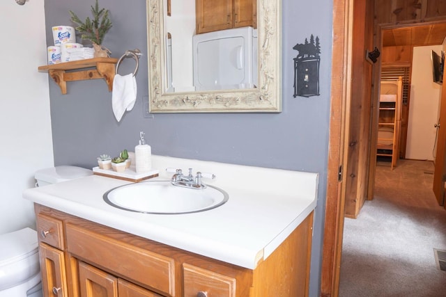 bathroom with vanity and toilet