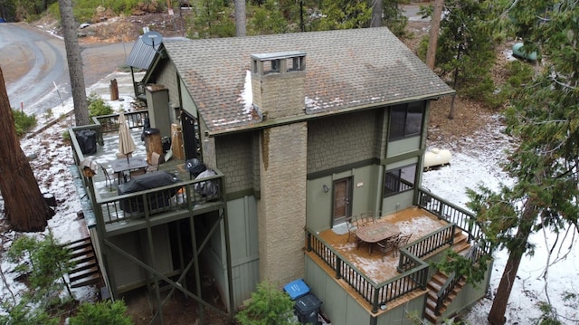 42135 Hanging Branch Rd, Shaver Lake, CA 93664 - back of house with stairs, a shingled roof, a deck, and a chimney