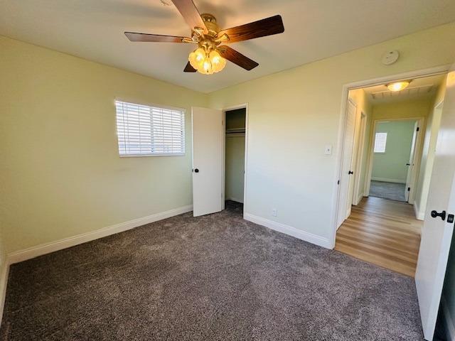 975 N Princeton Ave, Coalinga, CA 93210 - unfurnished bedroom featuring ceiling fan, a closet, and carpet