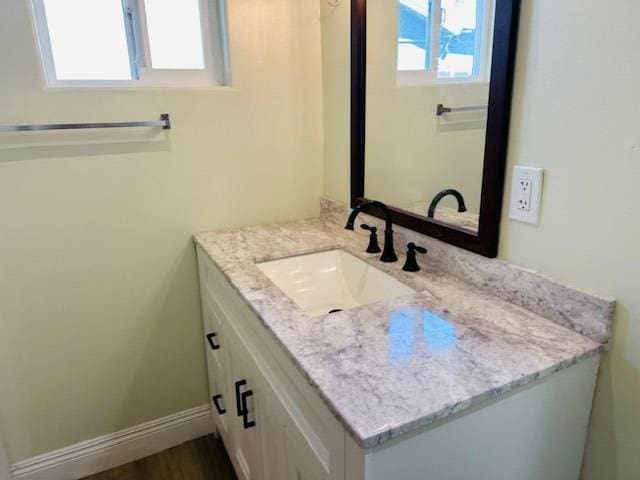 975 N Princeton Ave, Coalinga, CA 93210 - bathroom with vanity and wood-type flooring