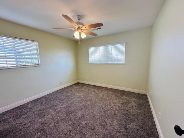 975 N Princeton Ave, Coalinga, CA 93210 - unfurnished room with ceiling fan and carpet flooring