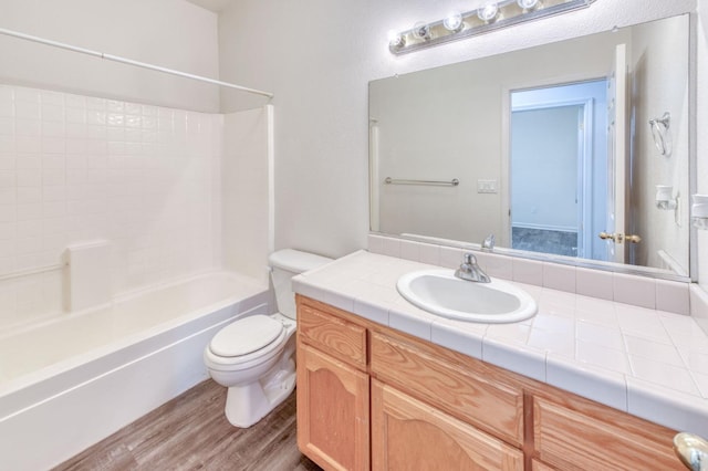 full bathroom with shower / bathing tub combination, vanity, toilet, and wood-type flooring