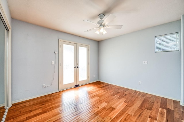 unfurnished room with light hardwood / wood-style flooring, french doors, and ceiling fan