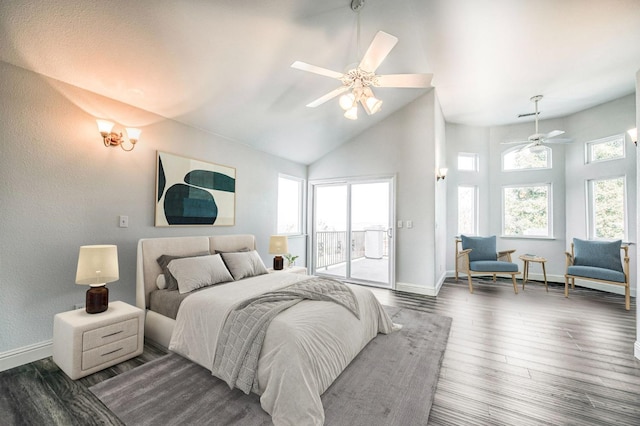 bedroom featuring dark wood-type flooring, ceiling fan, access to exterior, and multiple windows