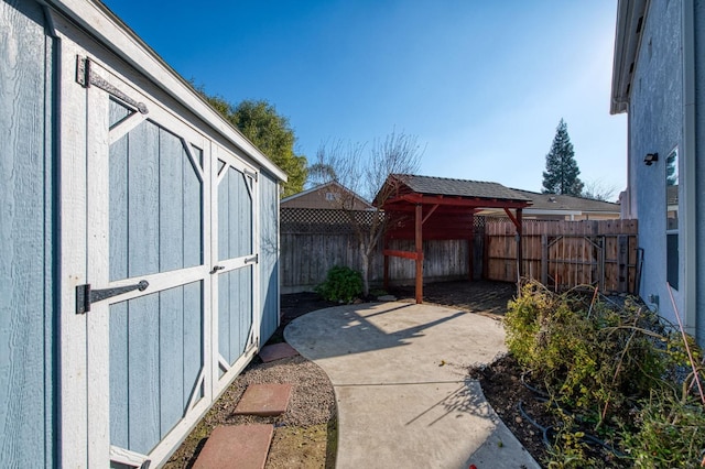 view of patio / terrace featuring a storage shed