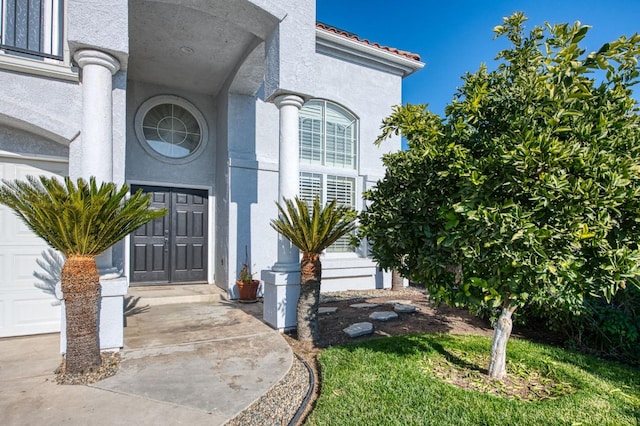 property entrance with a garage