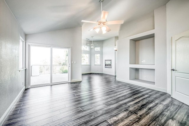 unfurnished living room with dark hardwood / wood-style flooring, high vaulted ceiling, built in features, and ceiling fan