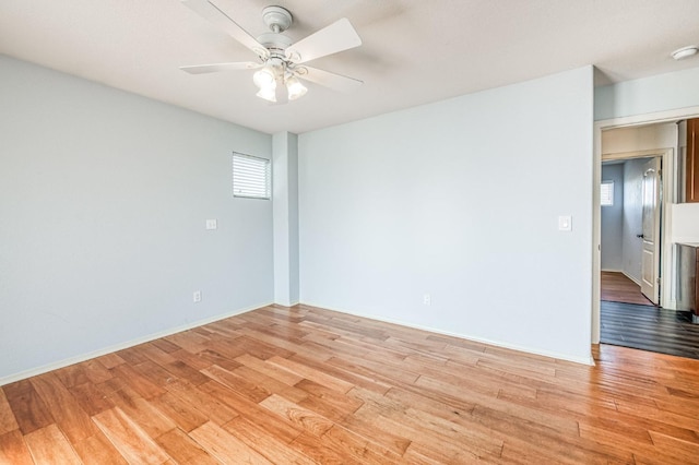 empty room featuring ceiling fan and light wood-type flooring