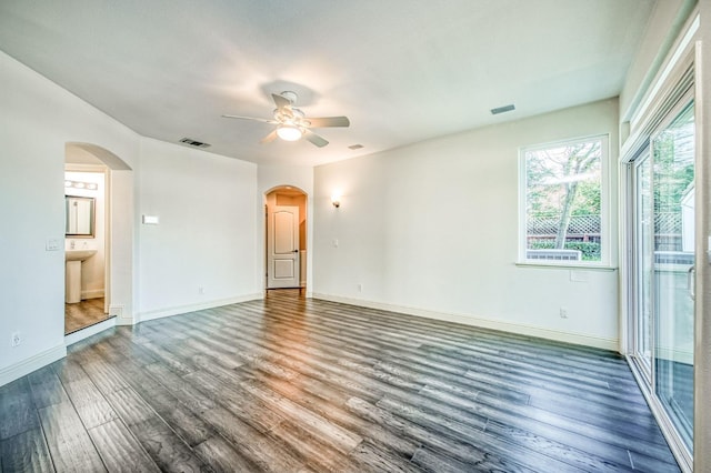 unfurnished room with ceiling fan, dark hardwood / wood-style flooring, and sink