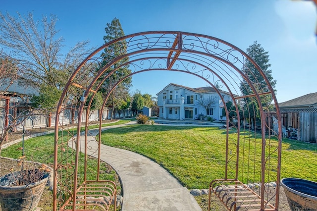 view of property's community with a yard