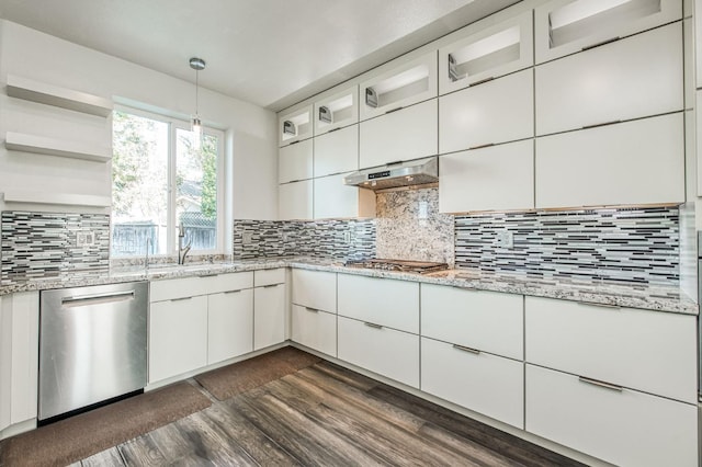 kitchen featuring tasteful backsplash, pendant lighting, appliances with stainless steel finishes, and white cabinets