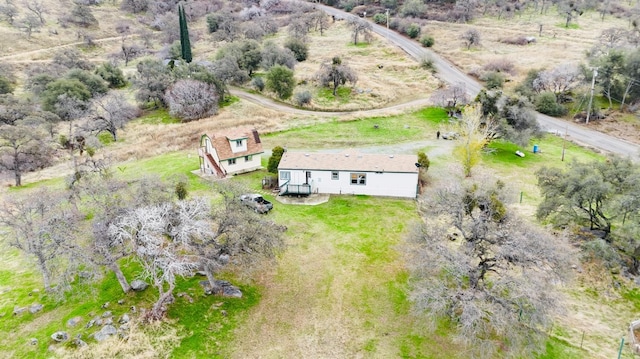 birds eye view of property featuring a rural view