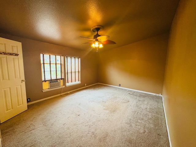 unfurnished room featuring carpet, a textured ceiling, ceiling fan, and cooling unit