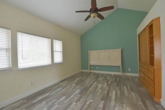 interior space featuring ceiling fan, lofted ceiling, and hardwood / wood-style flooring