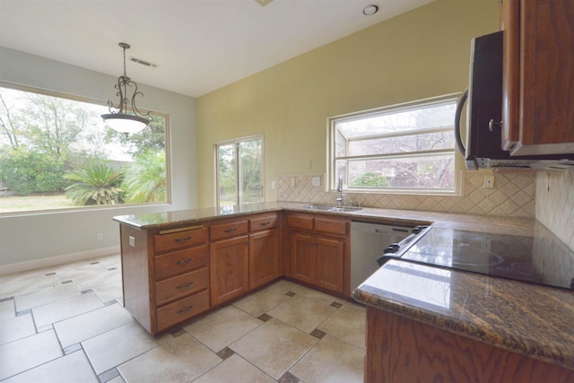 kitchen featuring kitchen peninsula, backsplash, black electric cooktop, white dishwasher, and sink