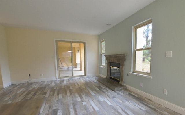 unfurnished living room featuring light wood-type flooring