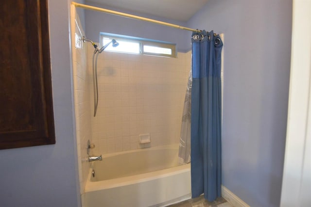 bathroom with shower / tub combo