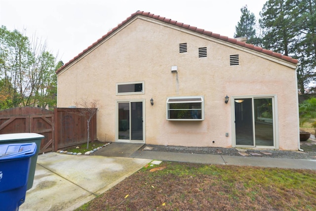 rear view of property featuring a patio