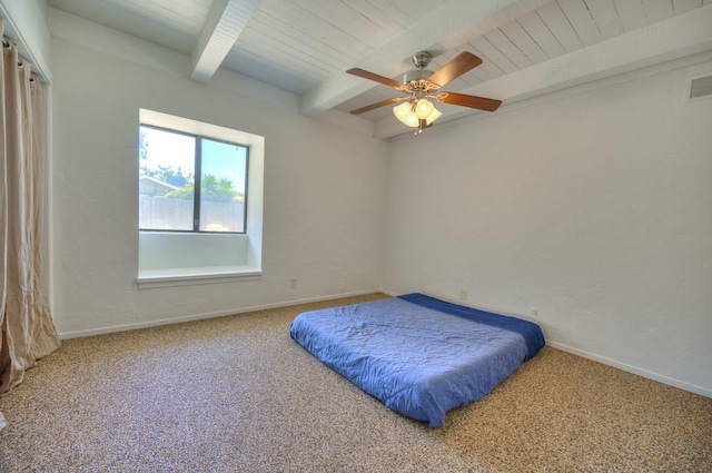 bedroom with beam ceiling, carpet floors, ceiling fan, and wooden ceiling