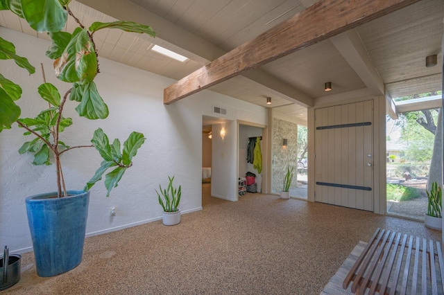 foyer with beam ceiling