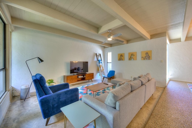 living room with ceiling fan and beamed ceiling