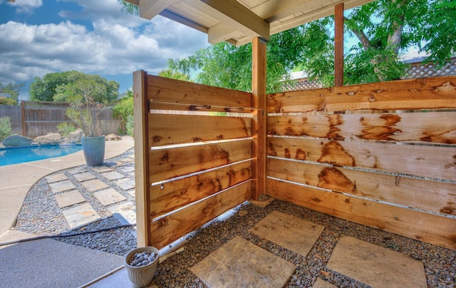 exterior space featuring a patio and a fenced in pool