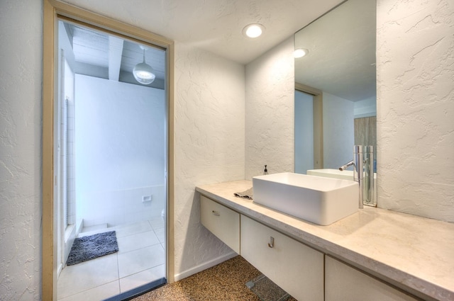 bathroom featuring tile patterned floors and vanity