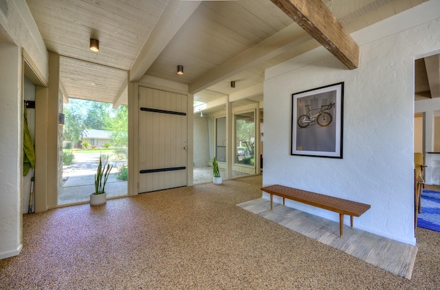 entrance foyer with beam ceiling and wooden ceiling