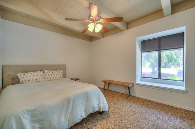 bedroom with beamed ceiling, carpet flooring, and ceiling fan