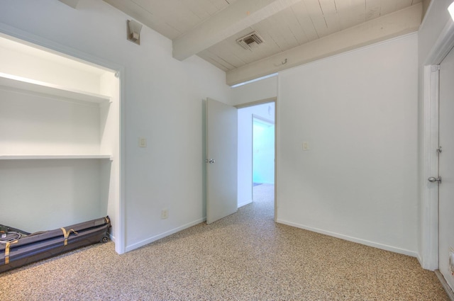 carpeted spare room with beamed ceiling and wood ceiling