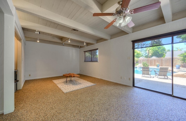 interior space featuring beam ceiling, ceiling fan, and track lighting