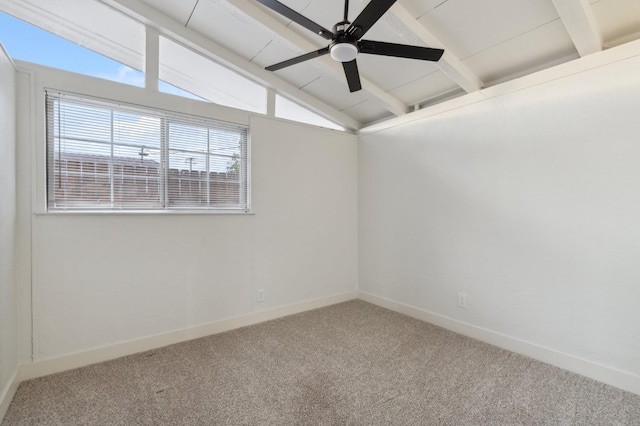 carpeted empty room with lofted ceiling with beams and ceiling fan