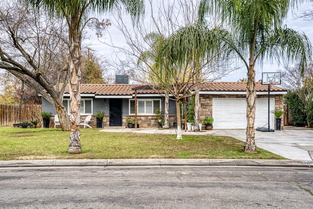 single story home featuring a garage and a front lawn