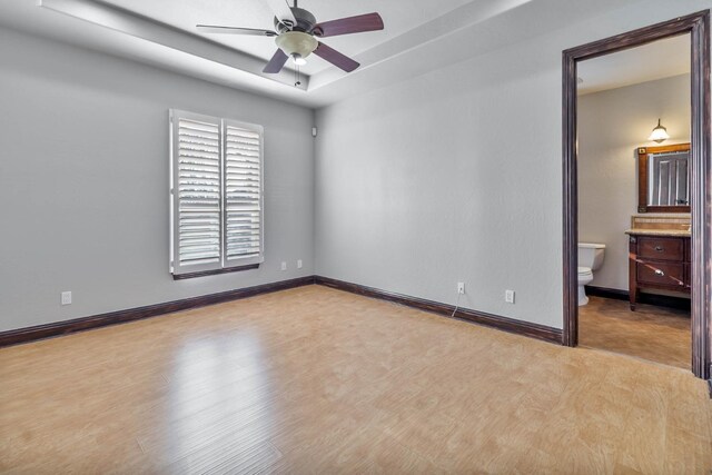 empty room featuring ceiling fan and light wood-type flooring