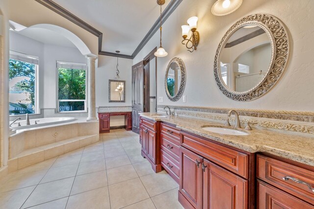 bathroom featuring decorative columns, tile patterned floors, ornamental molding, vanity, and tiled bath